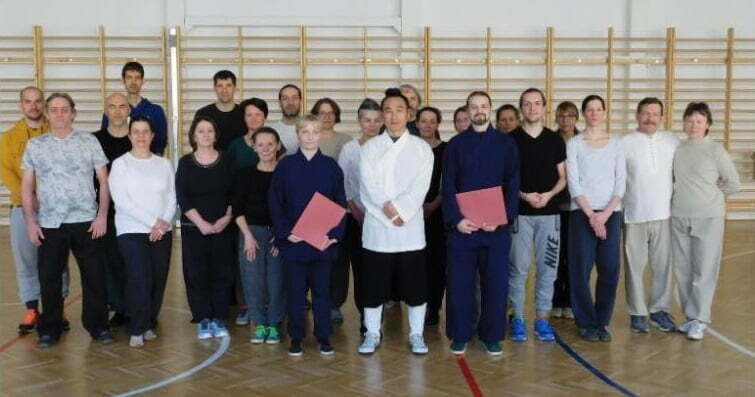 Photo of a Tai chi and Qigong Seminar fron 2022 in Hungary. 12 attendees plus the master and the 2 instructors are on the picture.